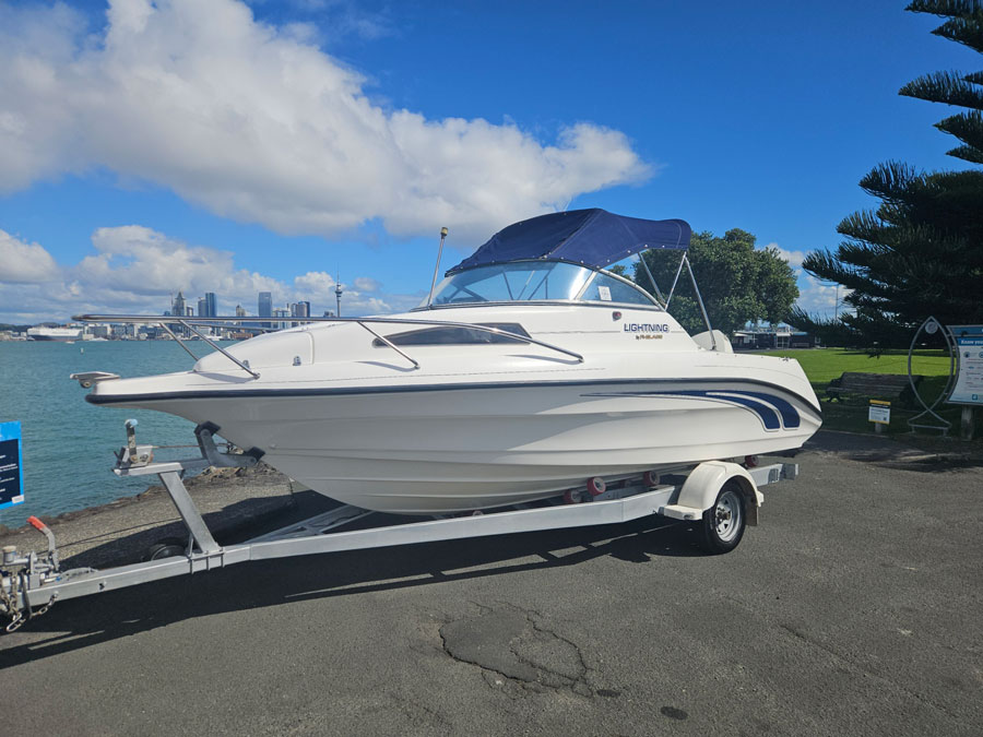 fi glass-lightning-560-cabin-boat-for-sale-auckland